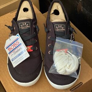 Skechers Black and White Sneakers with Lace-Up Design